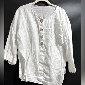 White blouse with gold buttons
